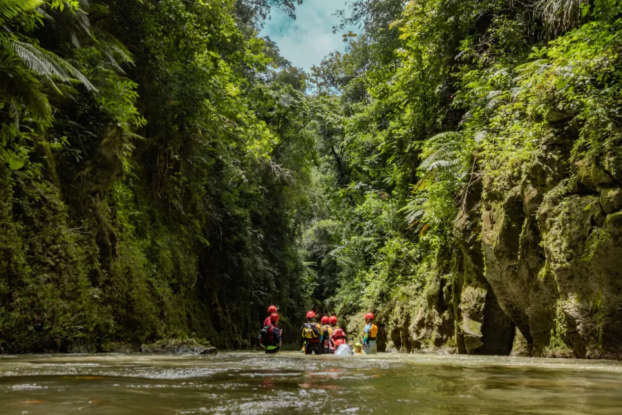 A group of people enjoying a rafting session in one of Puerto Rico's beautiful rivers.