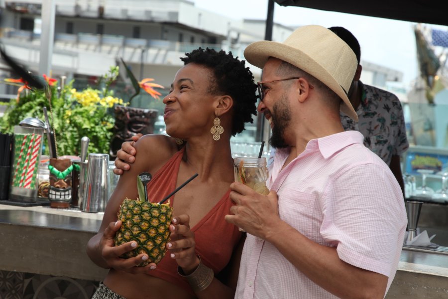 A couple enjoying a refreshing Piña Colada in Old San Juan, Puerto Rico