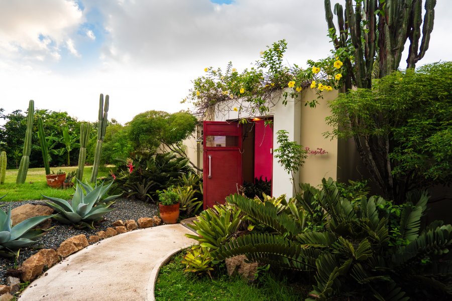 Image of the exterior of a red house at 4 Casitas in Puerto Rico 