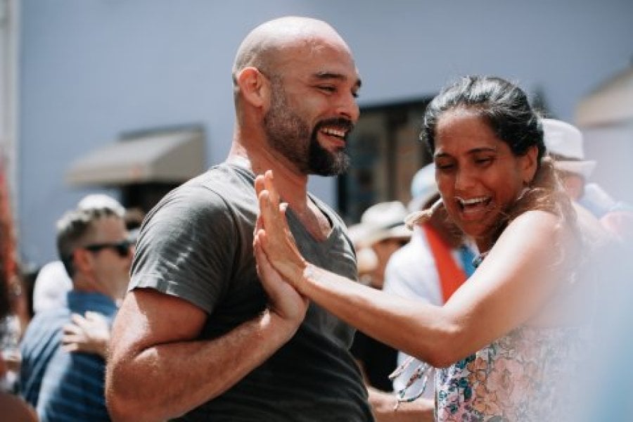 A couple dancing salsa in the streets of Old San Juan, Puerto Rico.