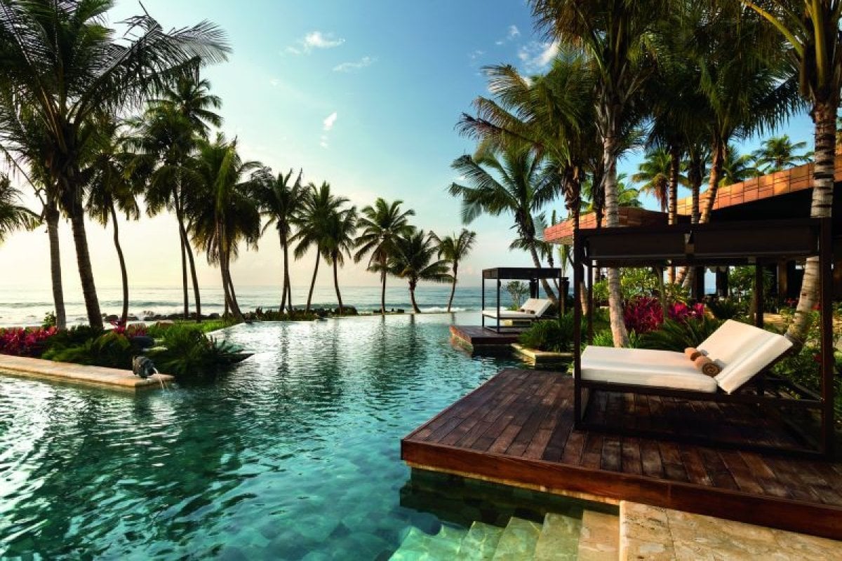 Luxury poolside lounging at Dorado Beach, a Ritz-Carlton Reserve—one of the best Puerto Rico resorts.
