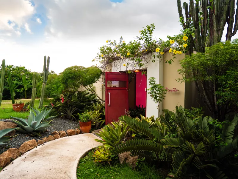 Image of the exterior of a red house at 4 Casitas in Puerto Rico 