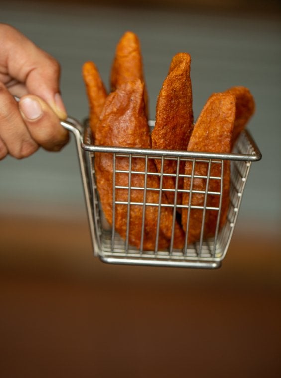 A basket filled with alcapurrias, fried traditional street food in Puerto Rico.