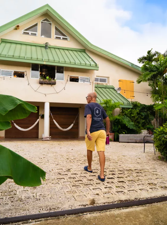 Image of a man walking towards a house at 4 Casitas in Puerto Rico 