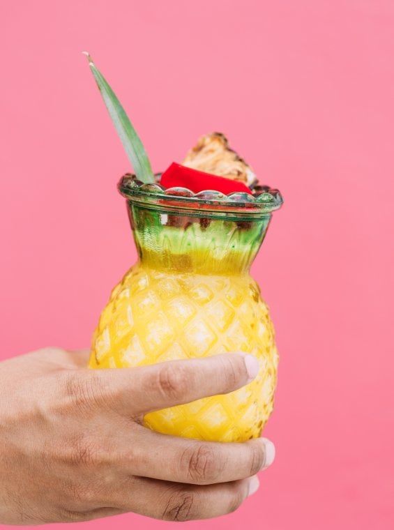 Puerto Rico's national drink, the piña colada, served in a fun pineapple-shapped glass.